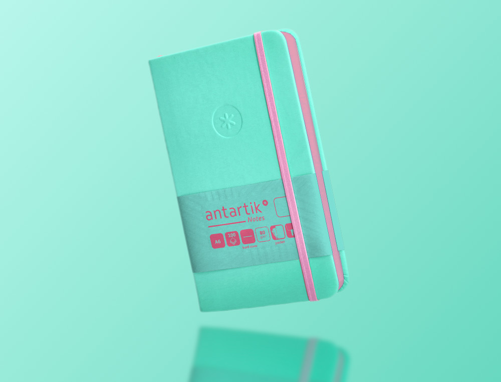 CUADERNO CON GOMILLA ANTARTIK NOTES TAPA DURA A6 HOJAS LISAS ROSA Y TURQUESA 100 HOJAS 80 GR FSC